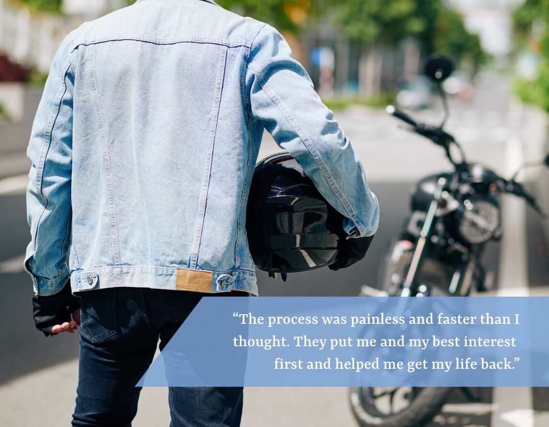 Man holding motorcycle helmet.