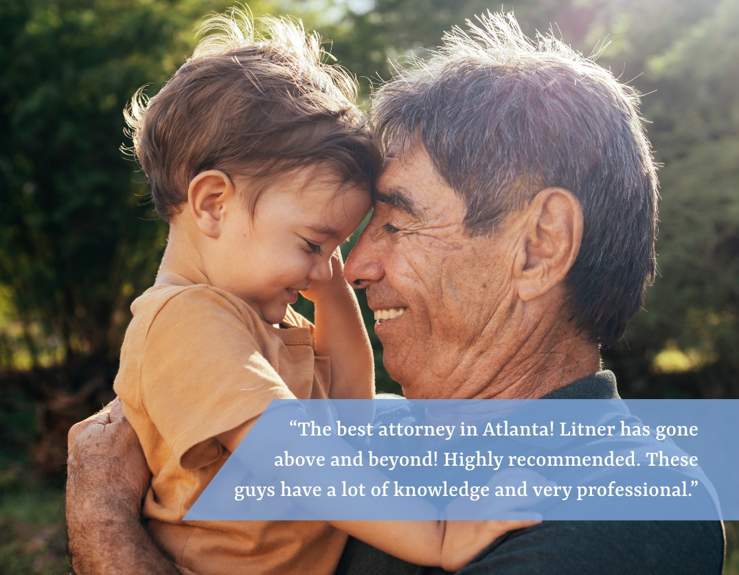 Happy elder man holding infant.