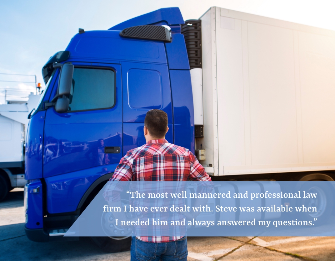 Man looking at semi truck