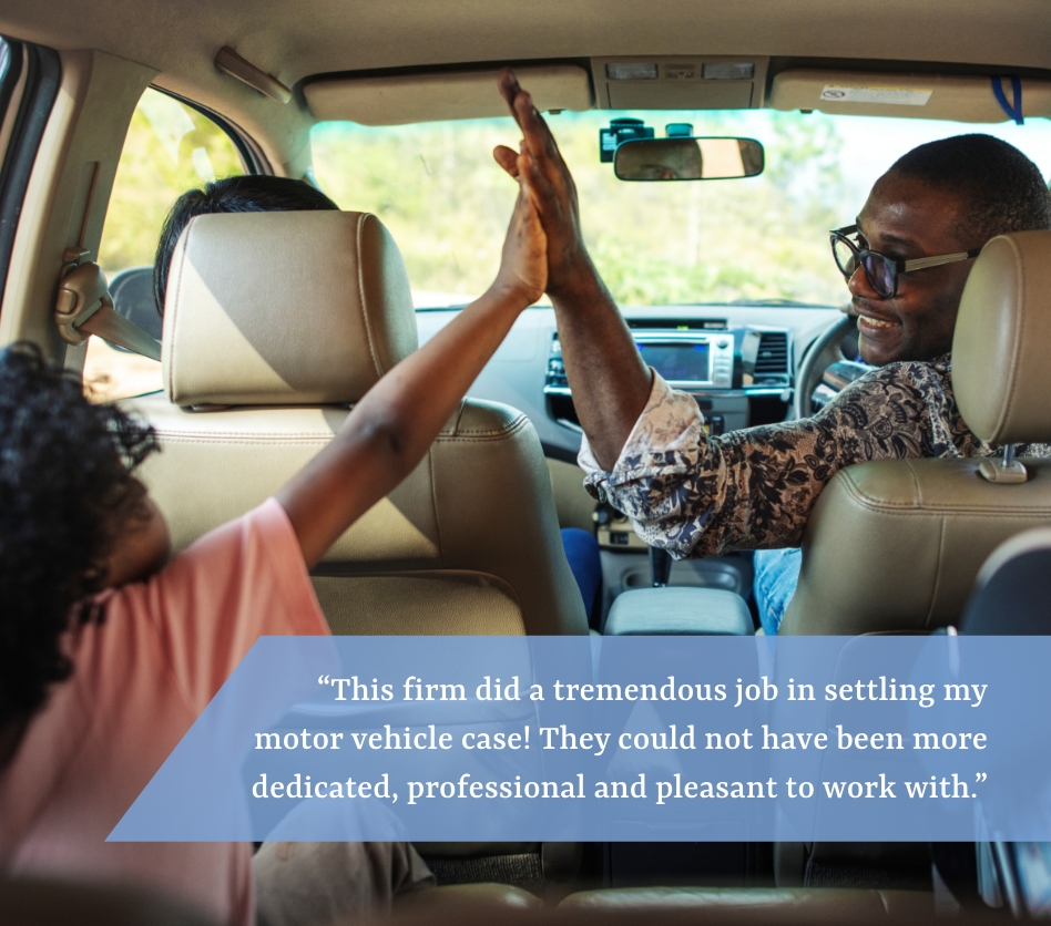 Young girl high-fiving man in car.