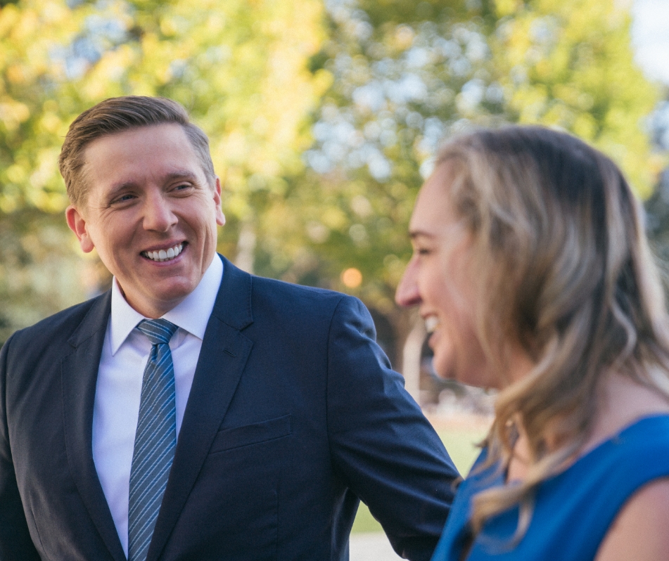 Man and woman laughing, smiling.