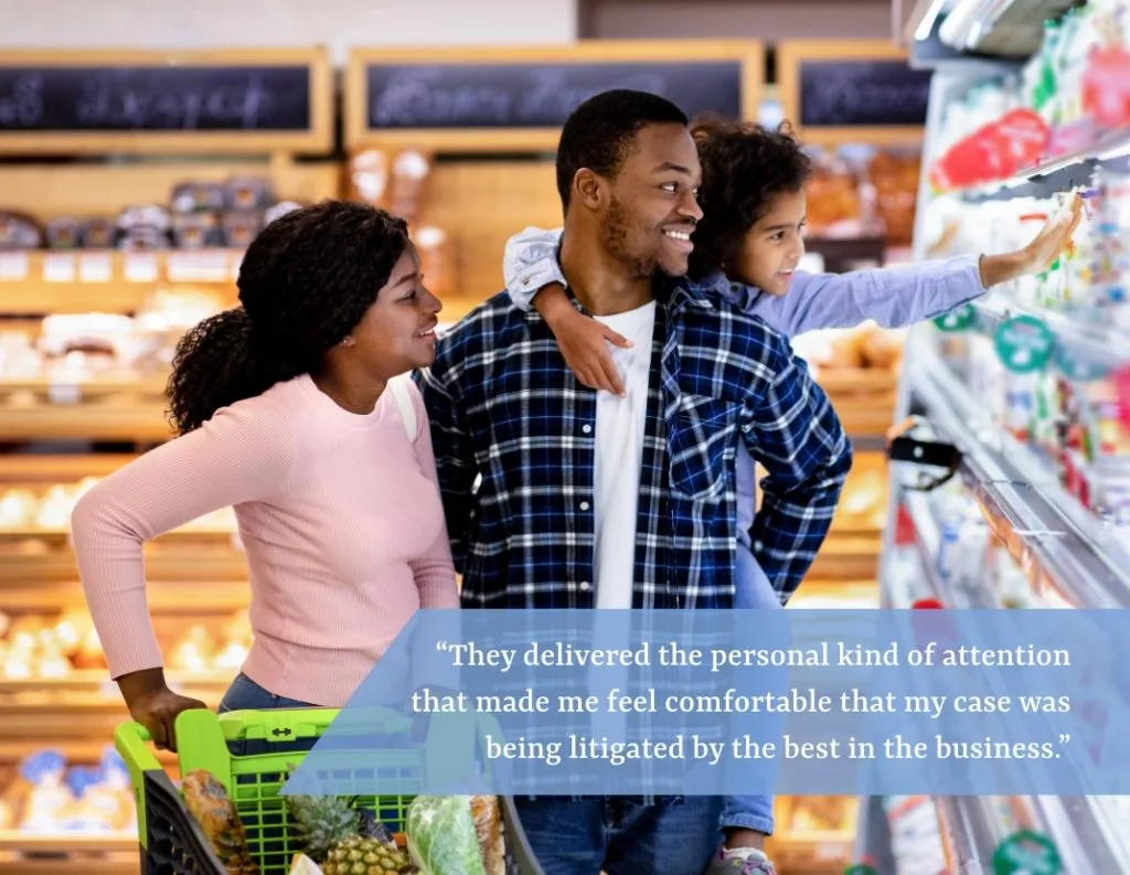 Couple with child in grocery store.